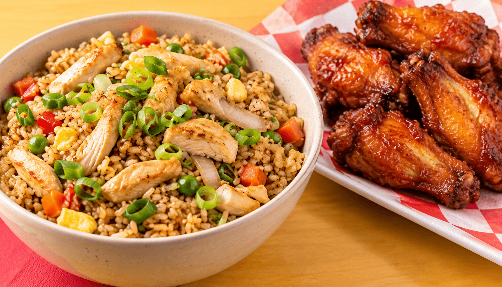 Illustrative chicken fried rice beside glazed chicken wings